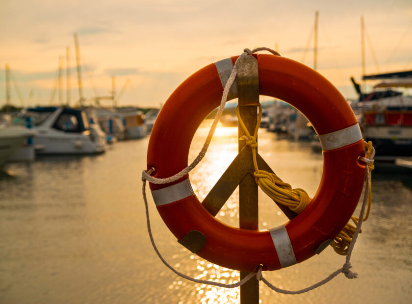 buoy at dock in front of sunset