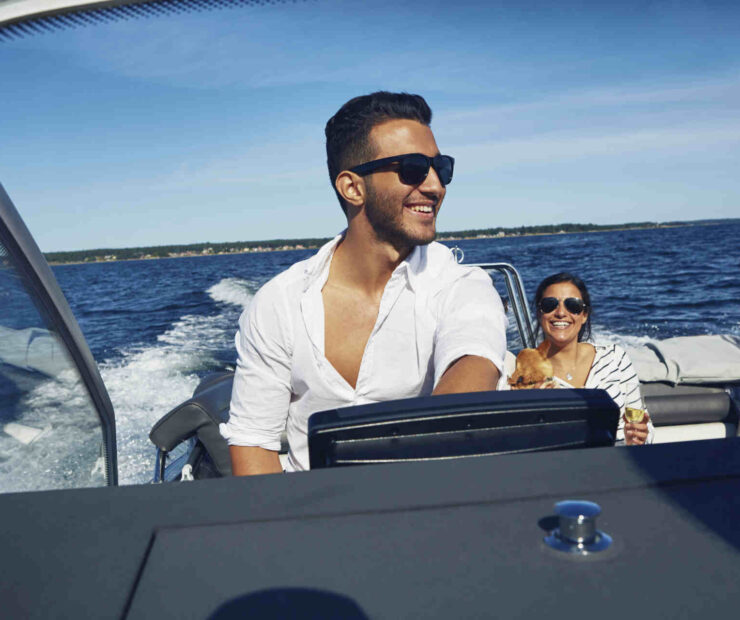 couple driving a nor-tech boat on florida waters