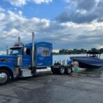 Peterbilt Unloading Nor-Tech into Lake